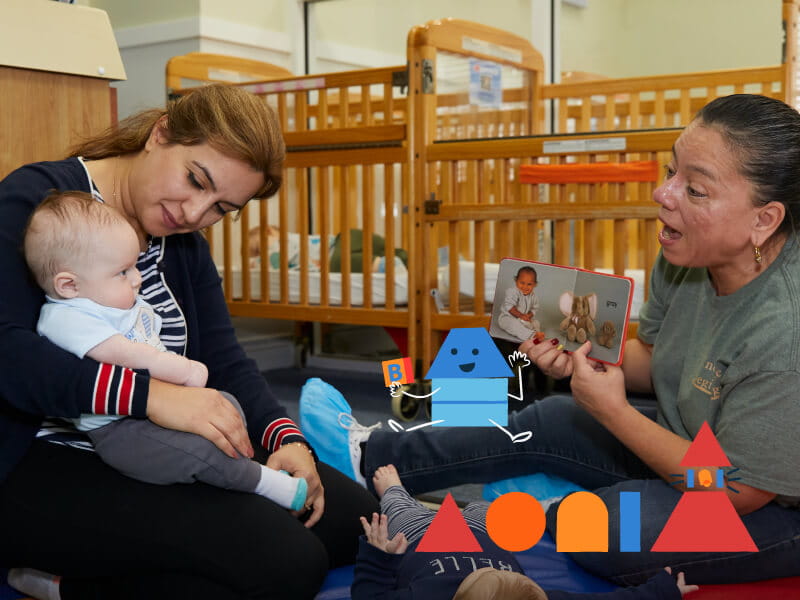 teacher holding infant