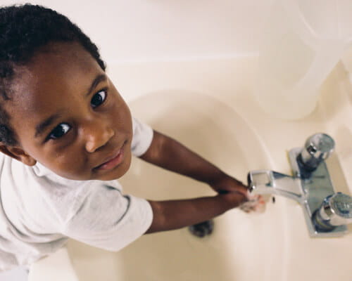 boy washing hands