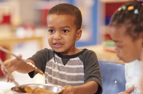 boy serving lunch